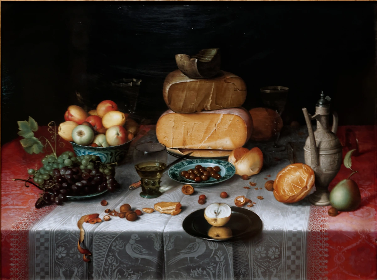 Still life painting featuring a variety of cheeses, fruits, nuts, and a peeled lemon, showcasing the sumptuousness and detail of Dutch Golden Age still life art.