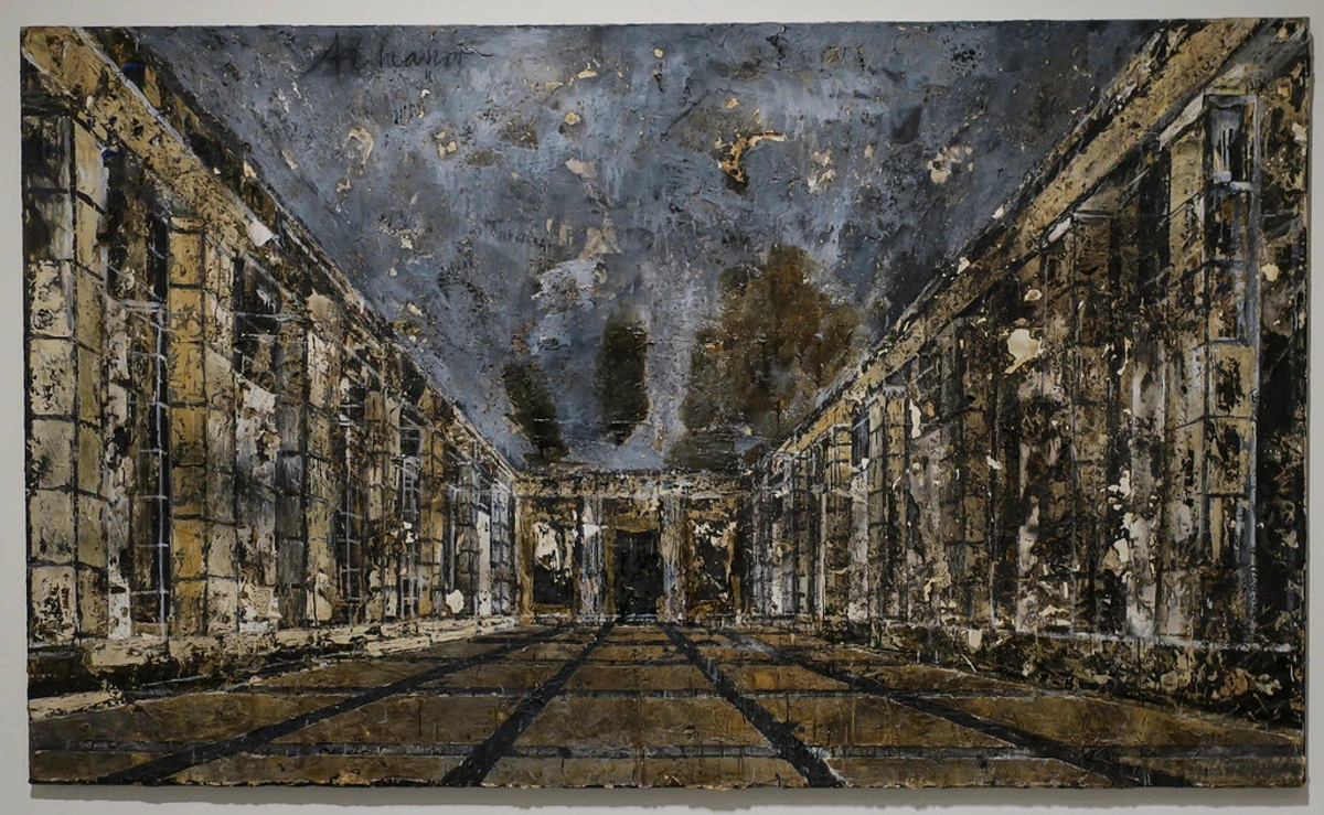 Anselm Kiefer painting depicting a long, dark, textured interior hall with columns and a gridded floor, characteristic of his monumental style.