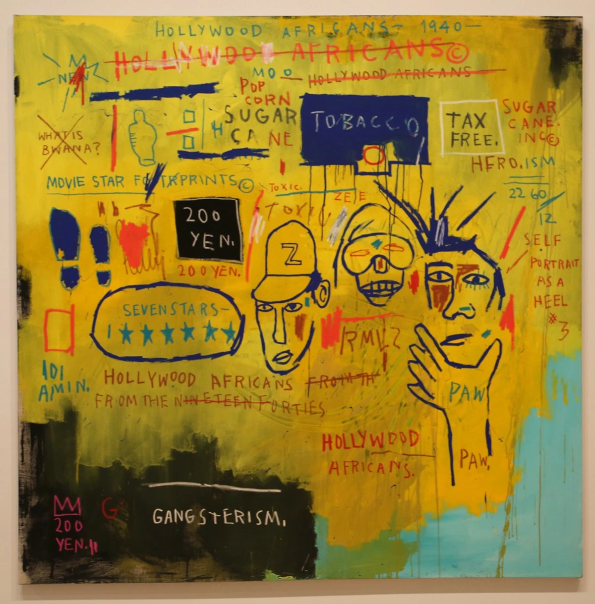 Jean-Michel Basquiat's 'Hollywood Africans' painting, featuring a vibrant yellow background with various texts like 'HOLLYWOOD AFRICANS', 'TOBACCO', 'TAX FREE', '200 YEN', and 'GANGSTERISM'. The artwork includes three stylized figures and symbols, characteristic of Basquiat's neo-expressionist style.