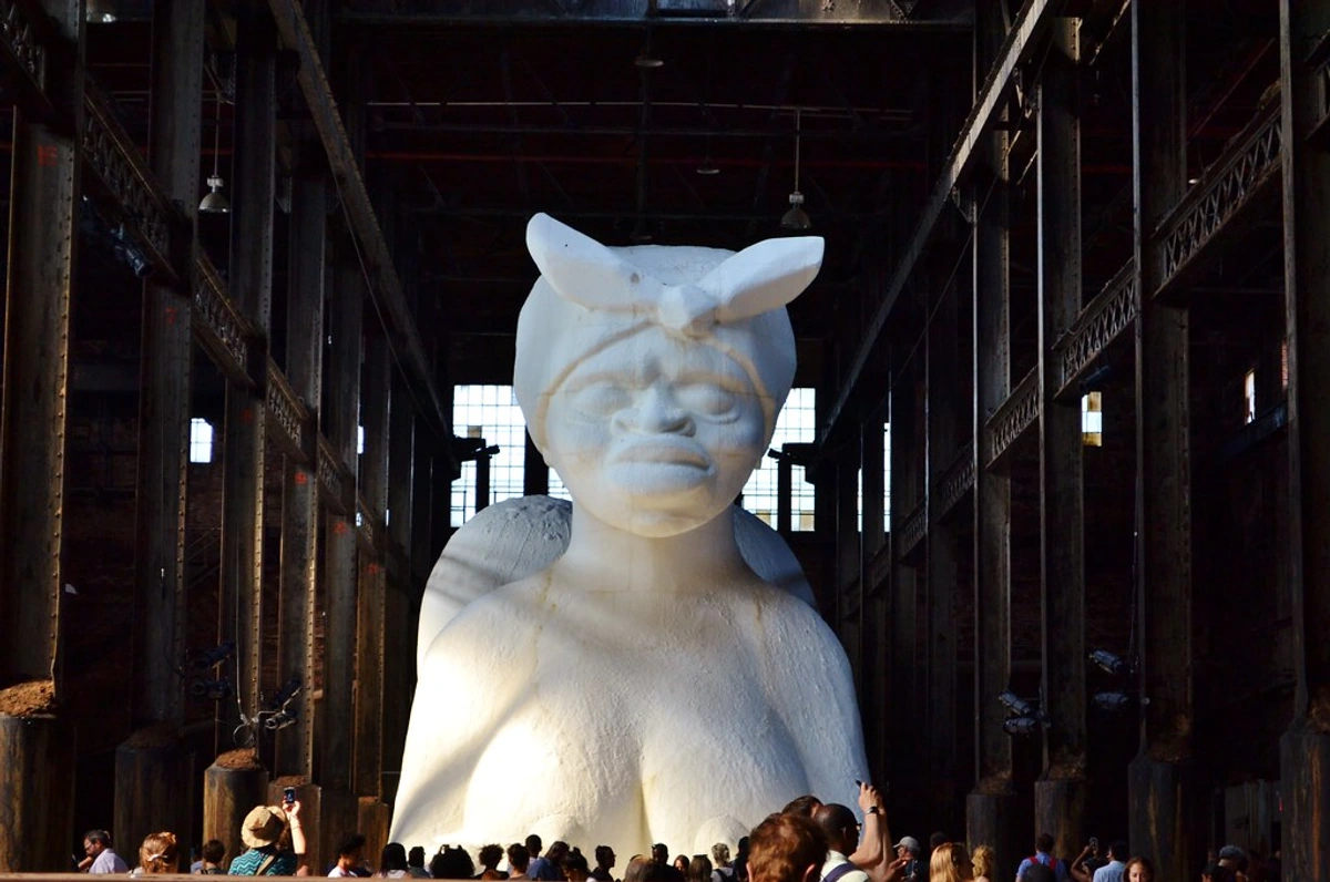 Kara Walker's A Subtlety, a giant sugar sphinx sculpture, inside the Domino Sugar Factory.