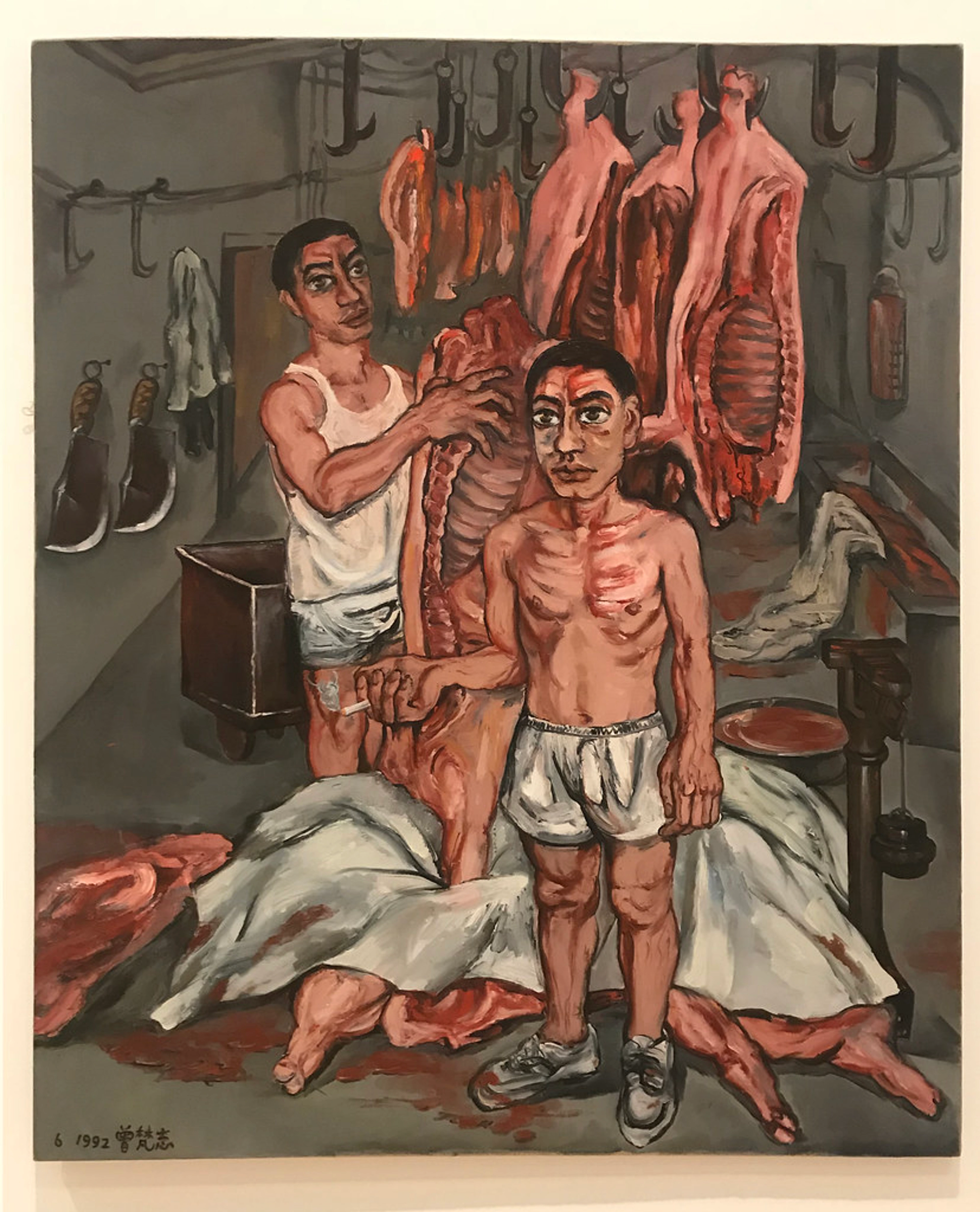 Oil painting 'Meat' by Zeng Fanzhi (1992) showing two men in a butcher shop with hanging raw meat and blood. Oil on canvas.