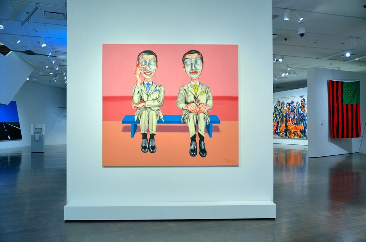 Zeng Fanzhi's 'MASK SERIES NO. 10' (1998) painting, depicting two figures on a blue bench, displayed in a contemporary art museum.