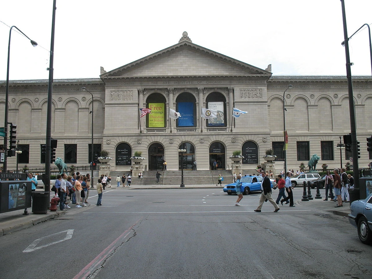 Exterior view of the Art Institute of Chicago building from across the street, showing its grand facade and entrance.