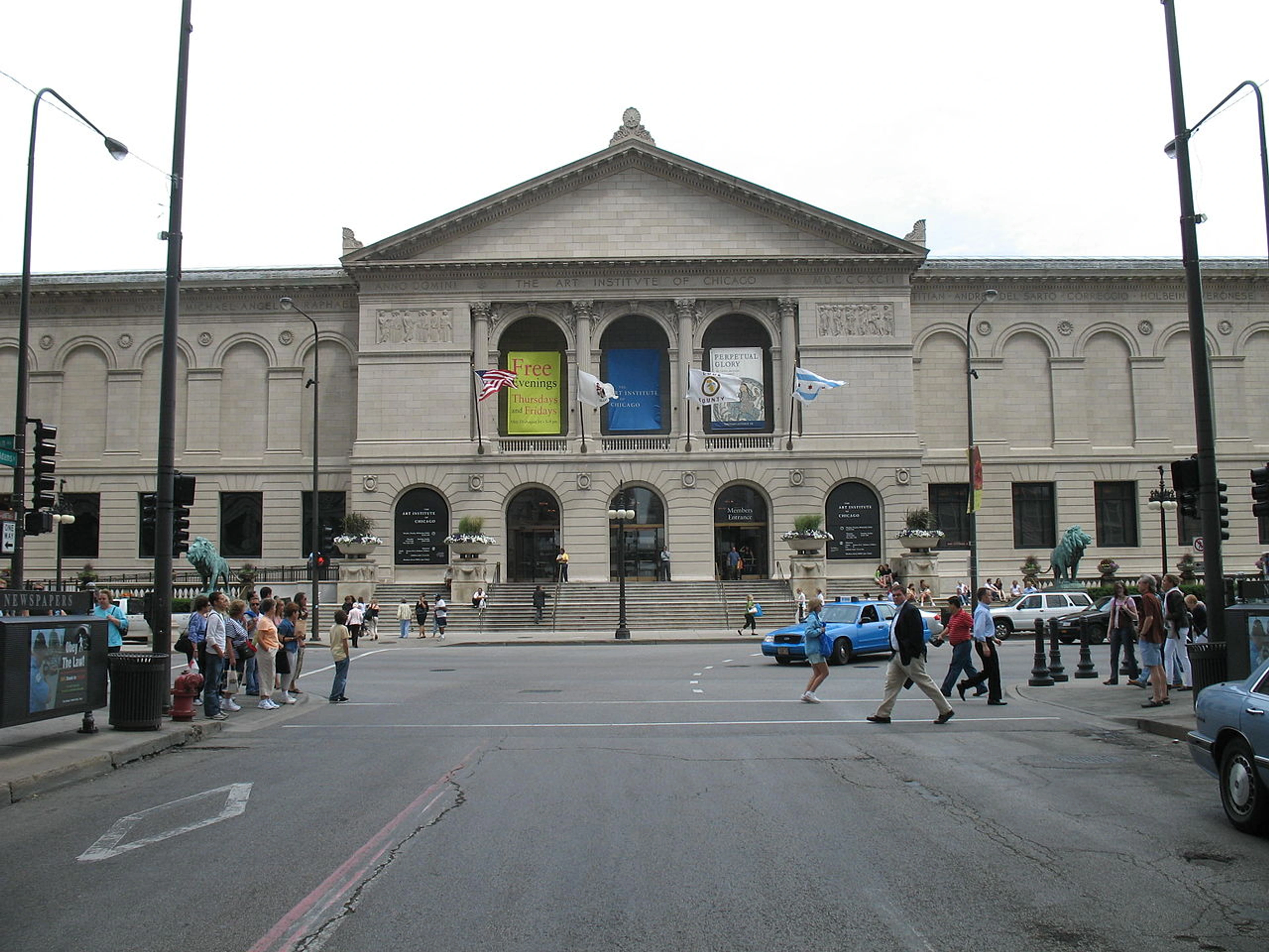 Exterior view of the Art Institute of Chicago building from across the street, showing its grand facade and entrance.