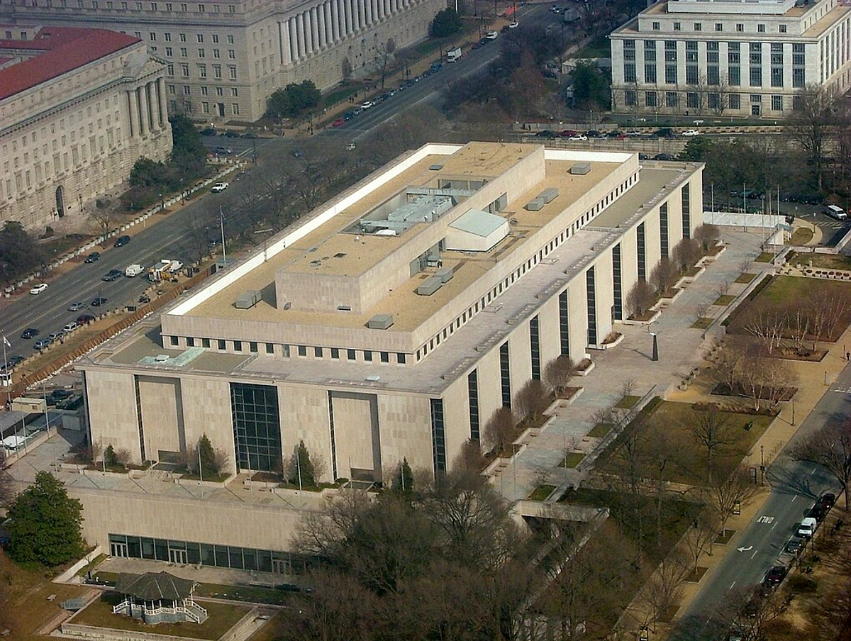 Overhead view of the National Museum of American History building in Washington, D.C., showing its rectangular structure and surrounding grounds.