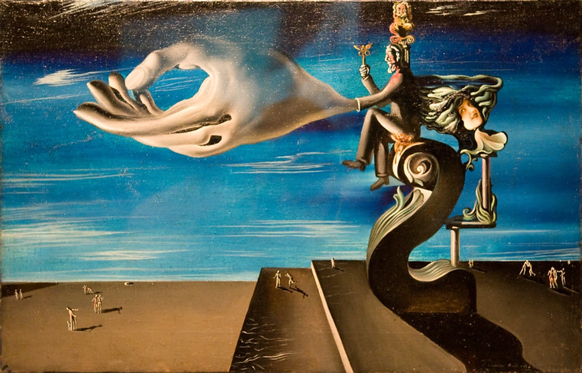 Surrealist painting by Salvador Dalí depicting a large, ethereal hand extending from the left, with a figure seated on a fantastical structure emanating from a face on the right. A barren landscape with small figures and geometric shapes occupies the lower portion under a blue sky.