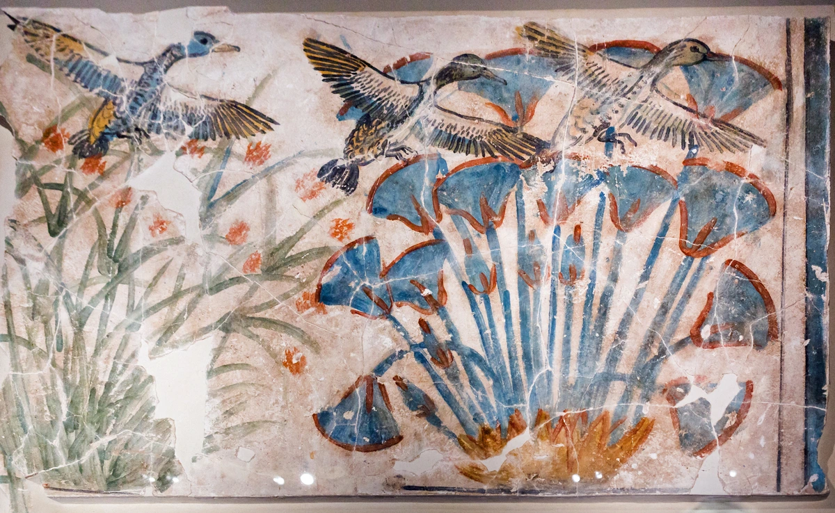 Wall painting of geese in a landscape with papyrus, showcasing the symbolism of birds in ancient art.