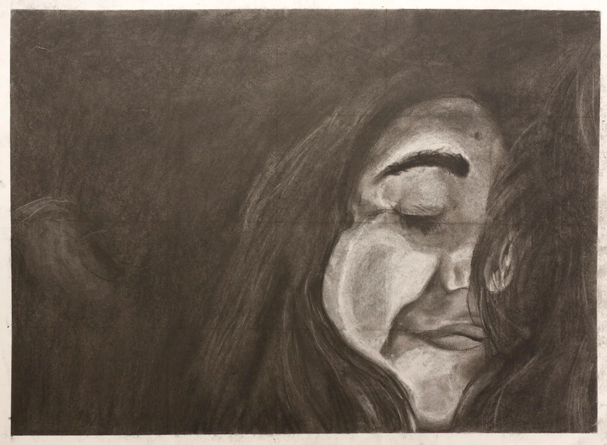 Charcoal self-portrait drawing, close-up of a face with eyes closed, rendered with dramatic shading and texture.