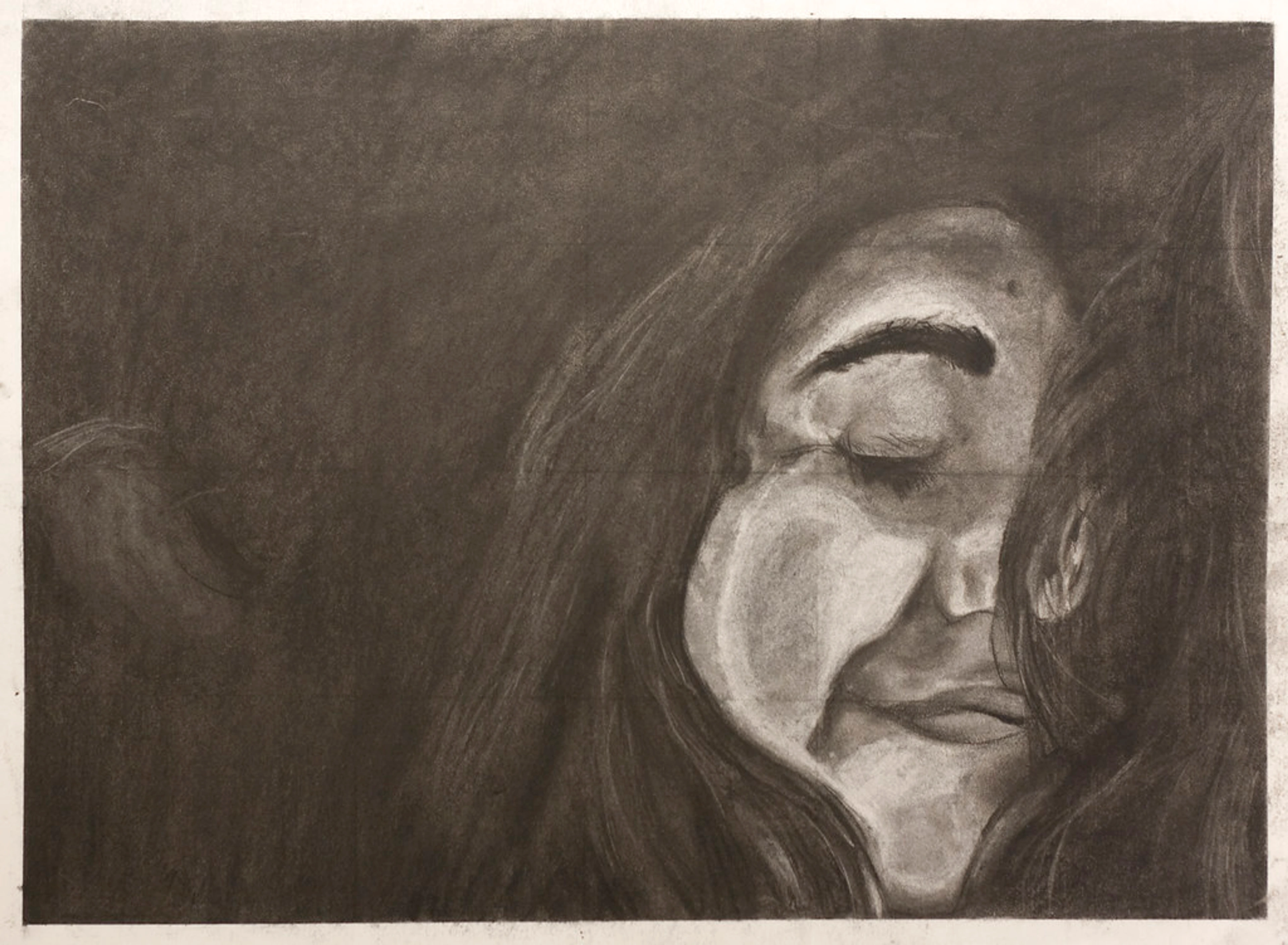 Charcoal self-portrait drawing, close-up of a face with eyes closed, rendered with dramatic shading and texture.