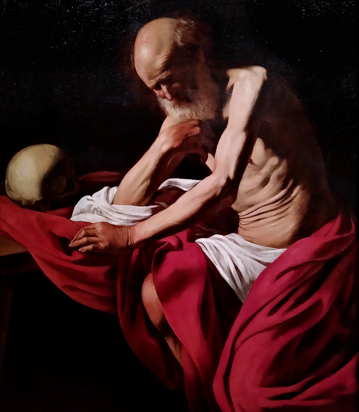 Saint Jerome Penitent by Caravaggio, showcasing tenebrism with dramatic light and shadow