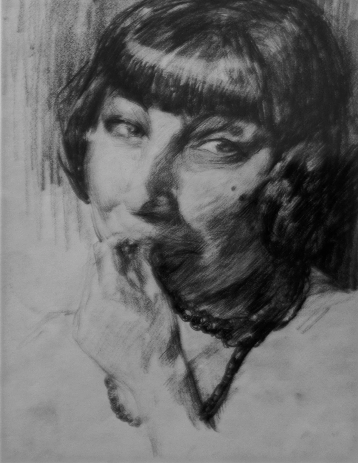 Expressive charcoal portrait of a woman with bangs and a necklace, titled Malicious Expression (1920) by Adriano de Sousa Lopes.